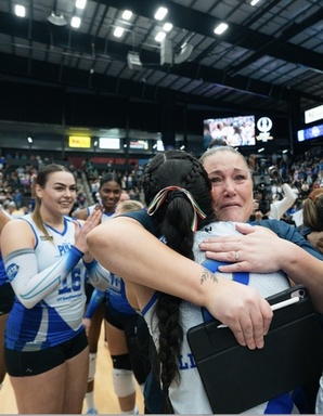 Coach Winzer hugging player.jpg